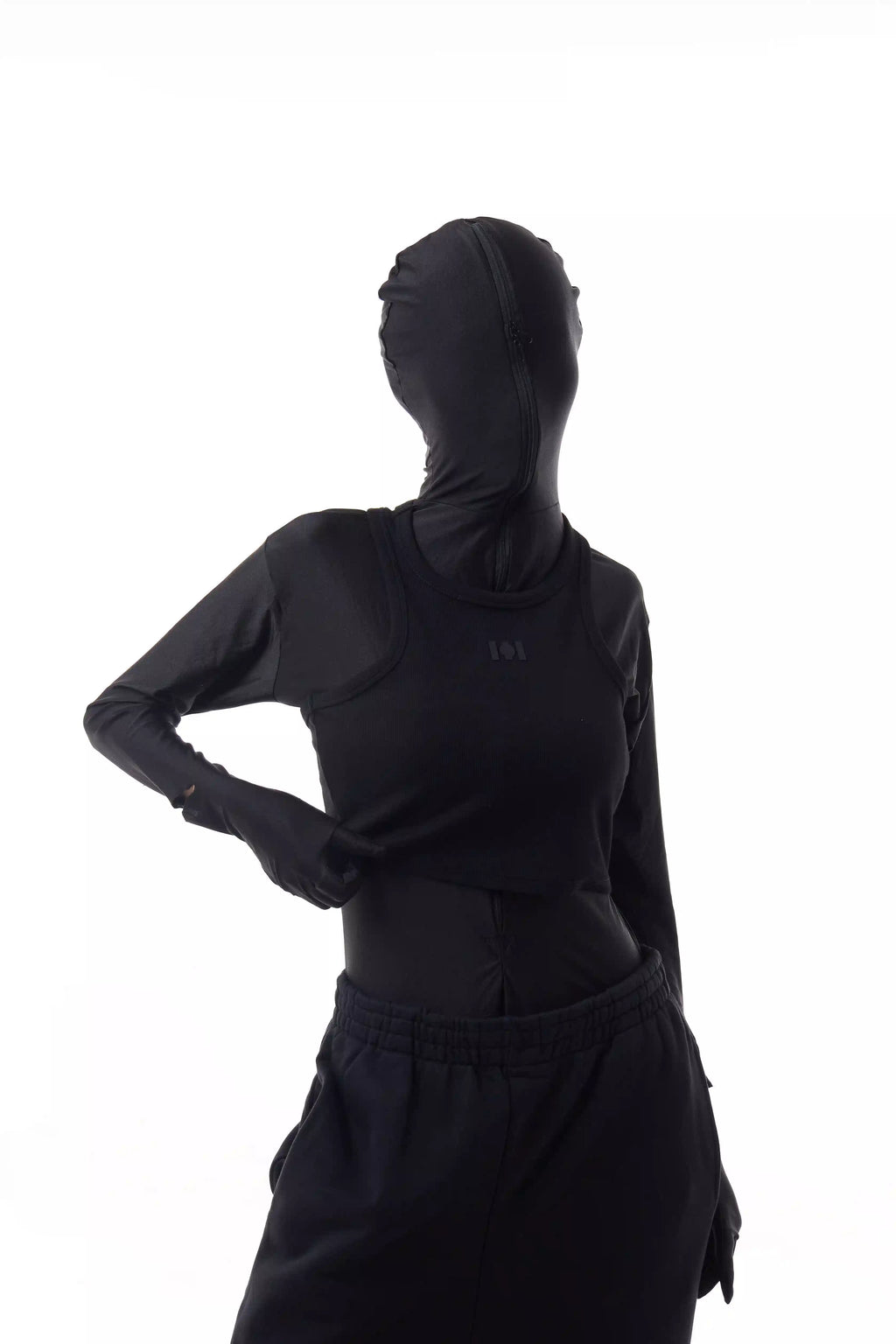 Person wearing a black Athletica Muscle Tee Tank