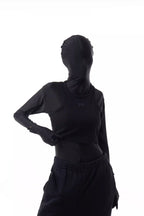 Person wearing a black Athletica Muscle Tee Tank