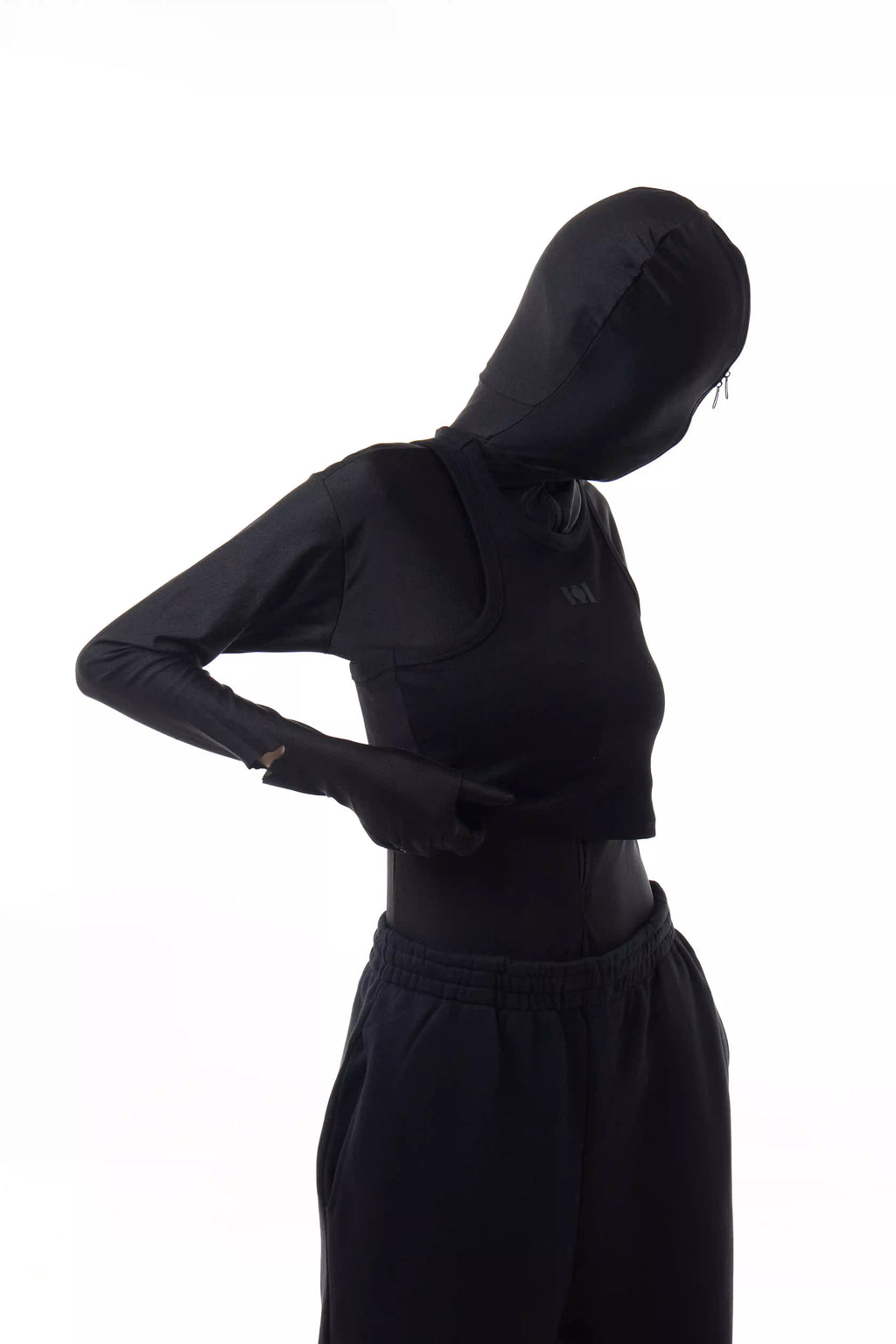 Person wearing a black Athletica Muscle Tee Tank