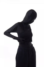 Person wearing a black Athletica Muscle Tee Tank
