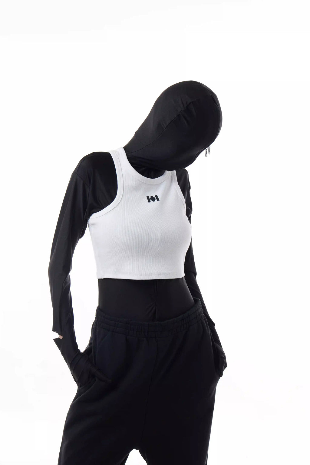 Person wearing a white Athletica Muscle Tee Tank