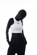 Person wearing a white Athletica Muscle Tee Tank