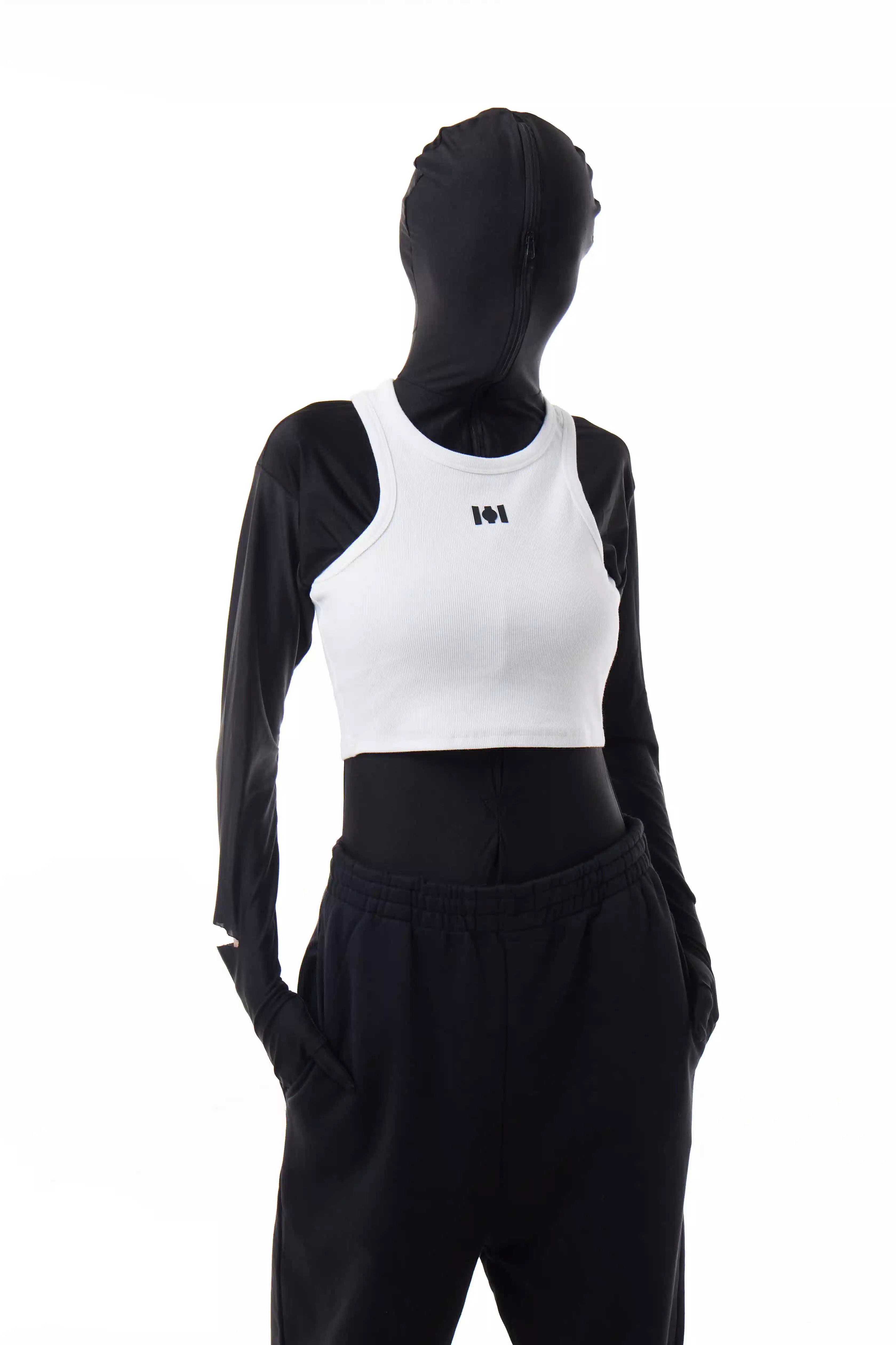 Person wearing a white Athletica Muscle Tee Tank