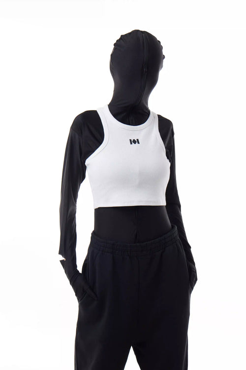 Person wearing a white Athletica Muscle Tee Tank