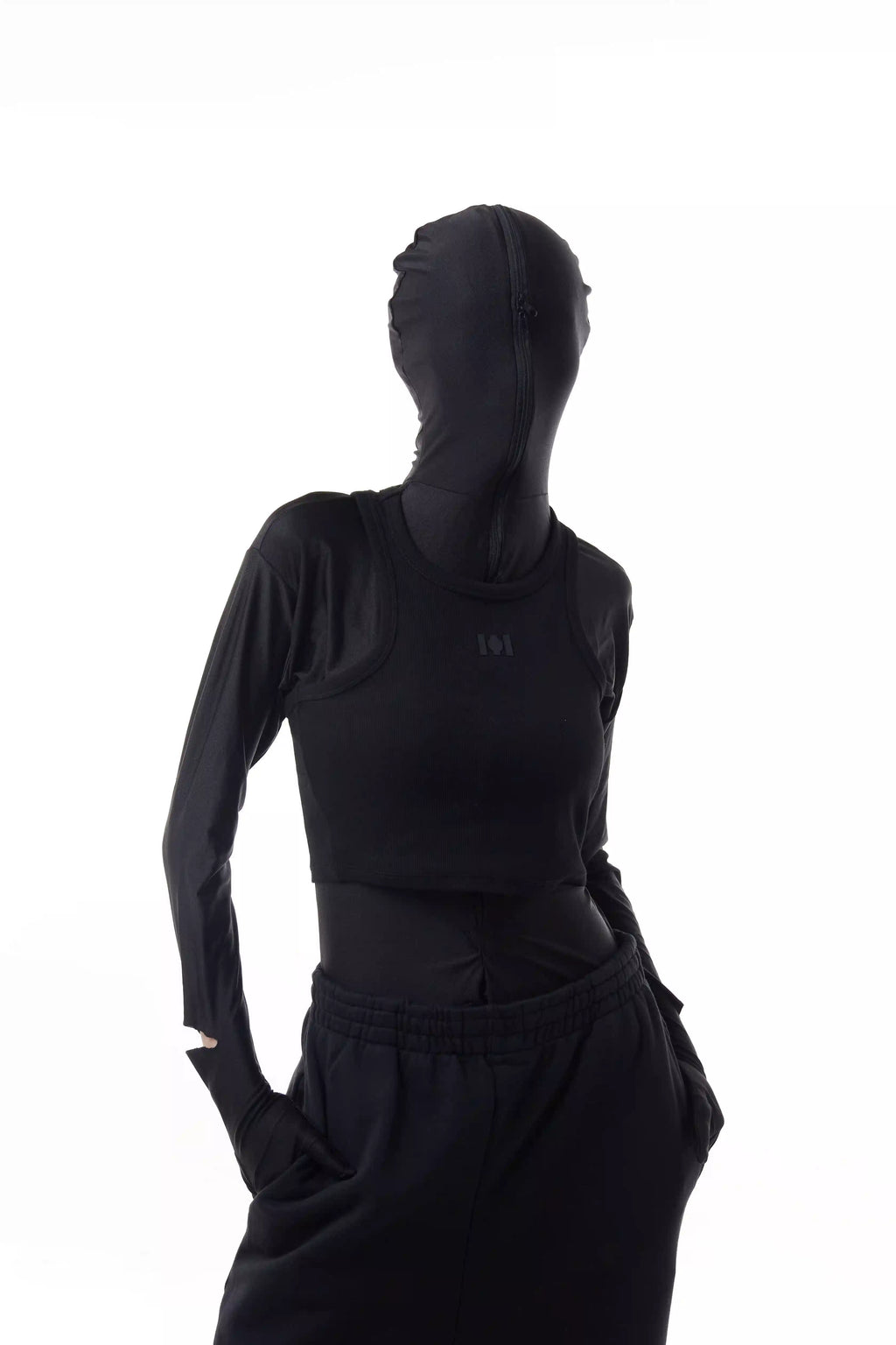 Person wearing a black Athletica Muscle Tee Tank