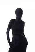 Person wearing a black Athletica Muscle Tee Tank