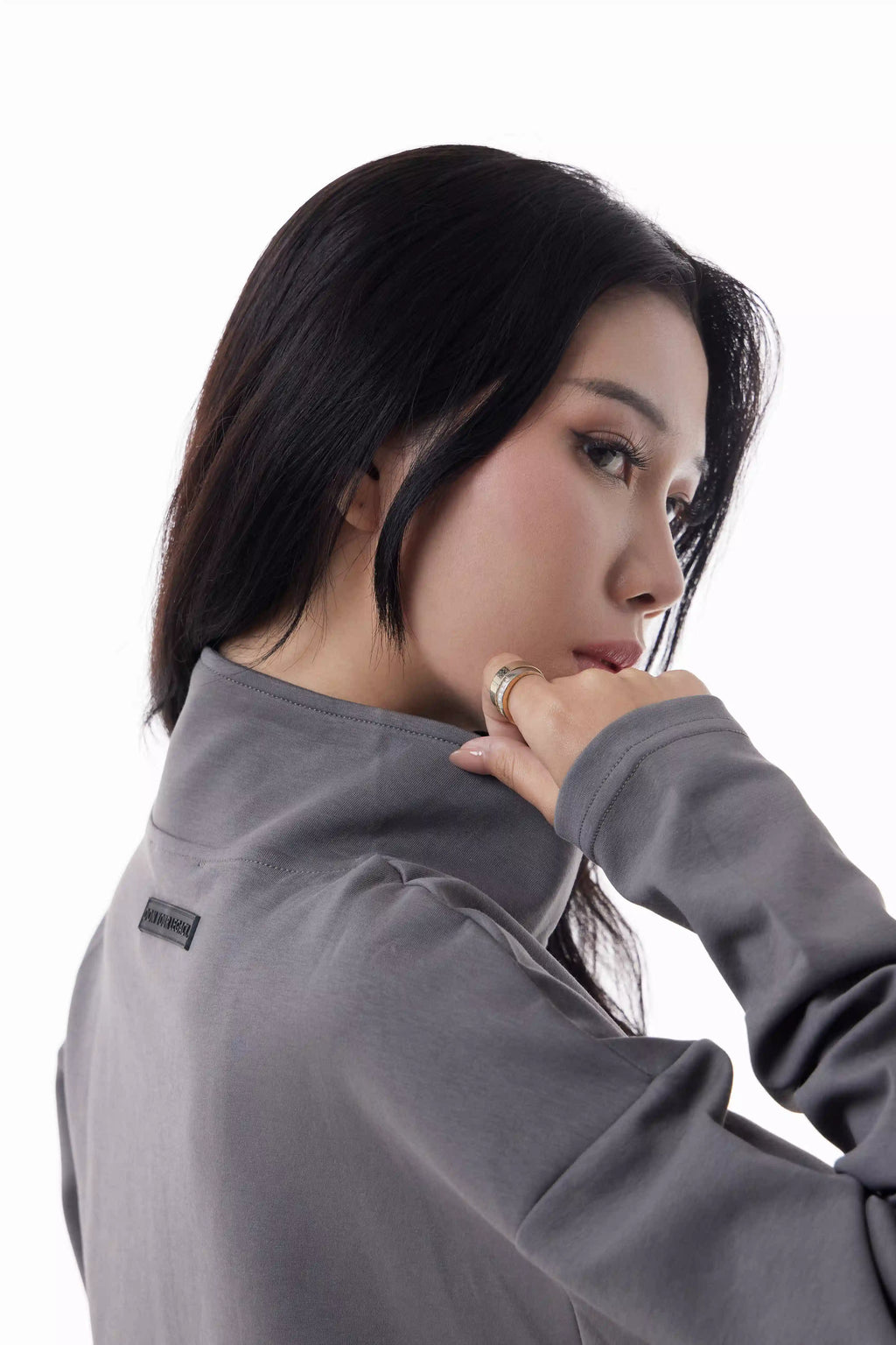Woman wearing a gray Core Zip Up