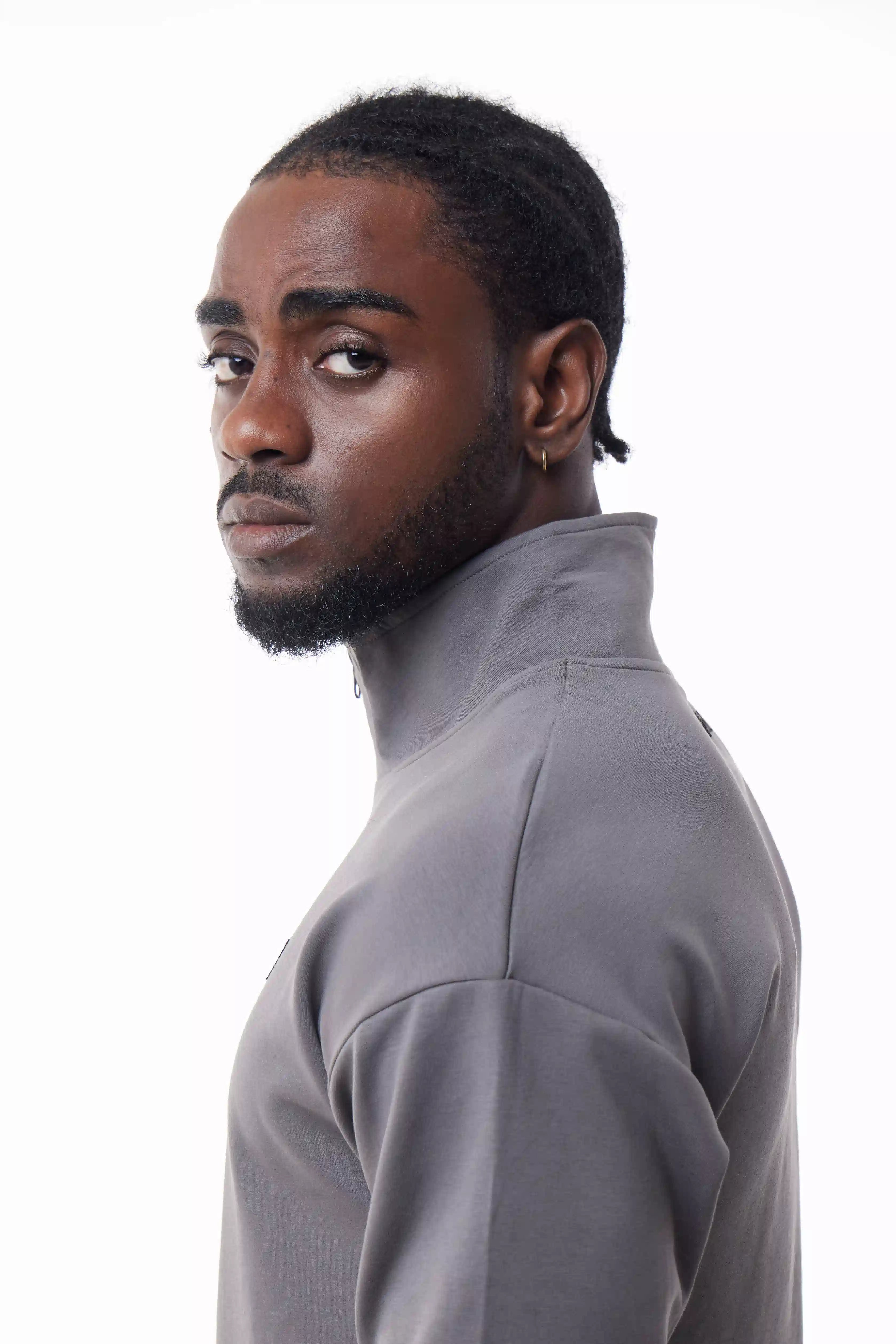 Man wearing a gray Core Zip Up