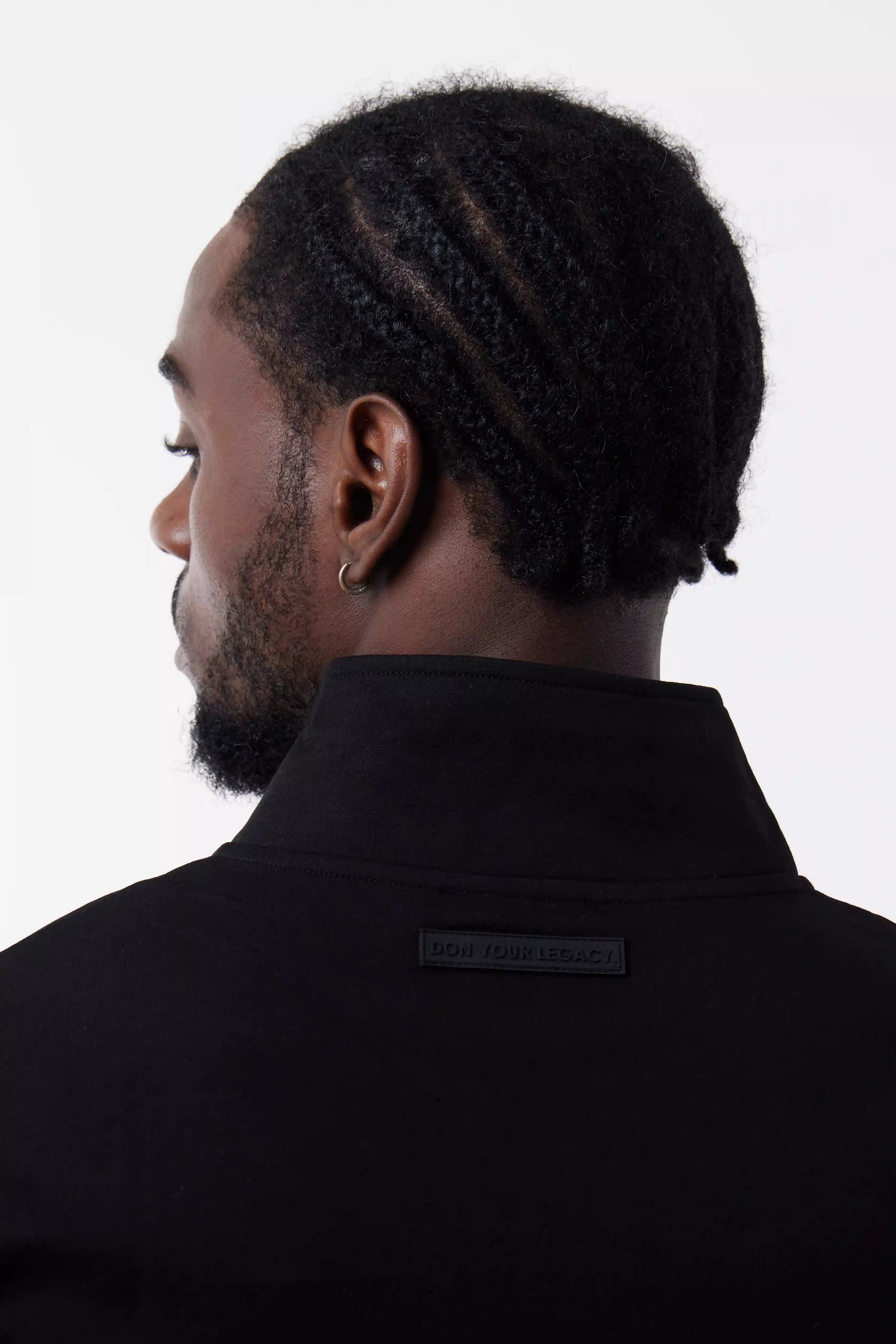Man wearing a black Core Zip Up
