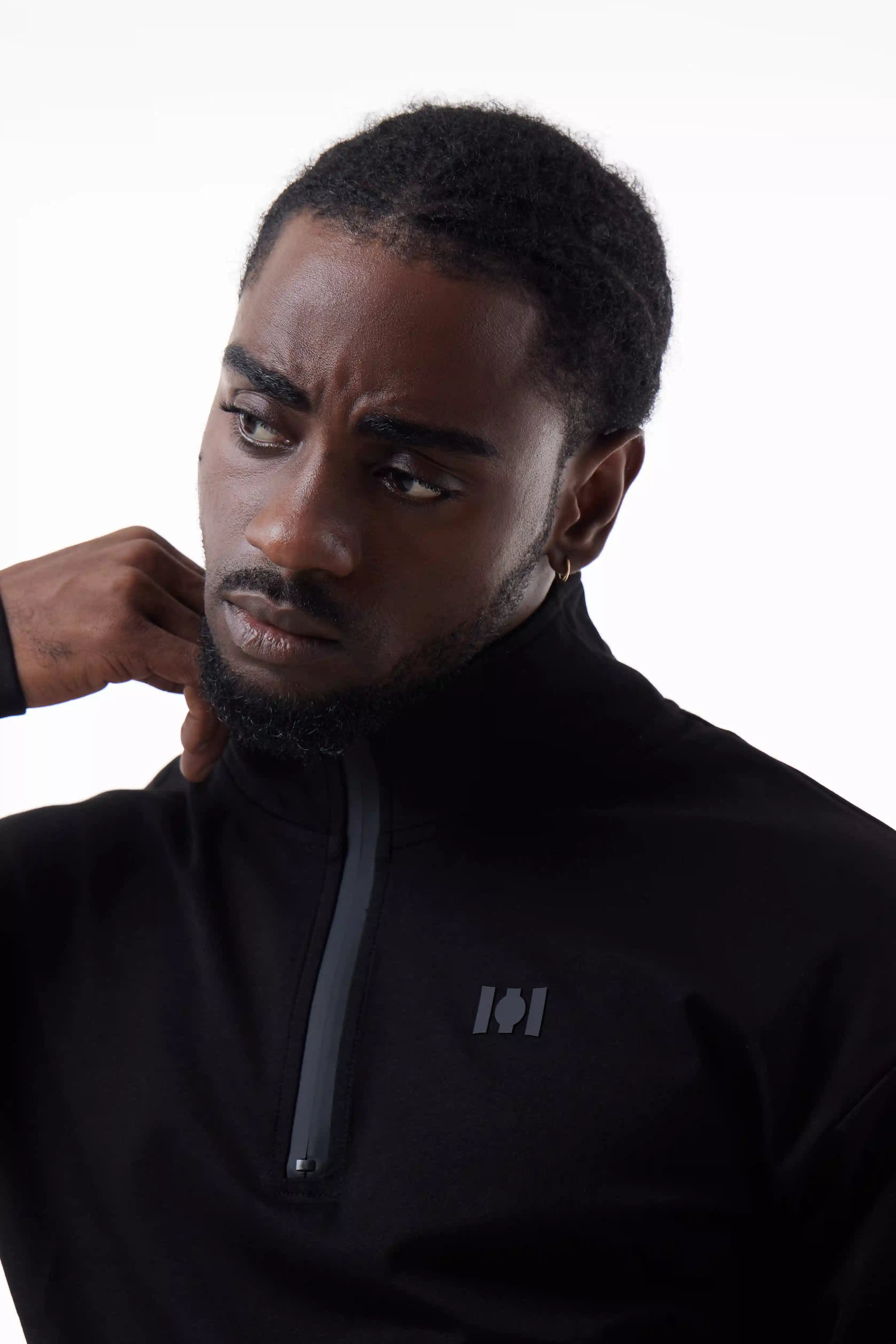 Man wearing a  black Core Zip Up