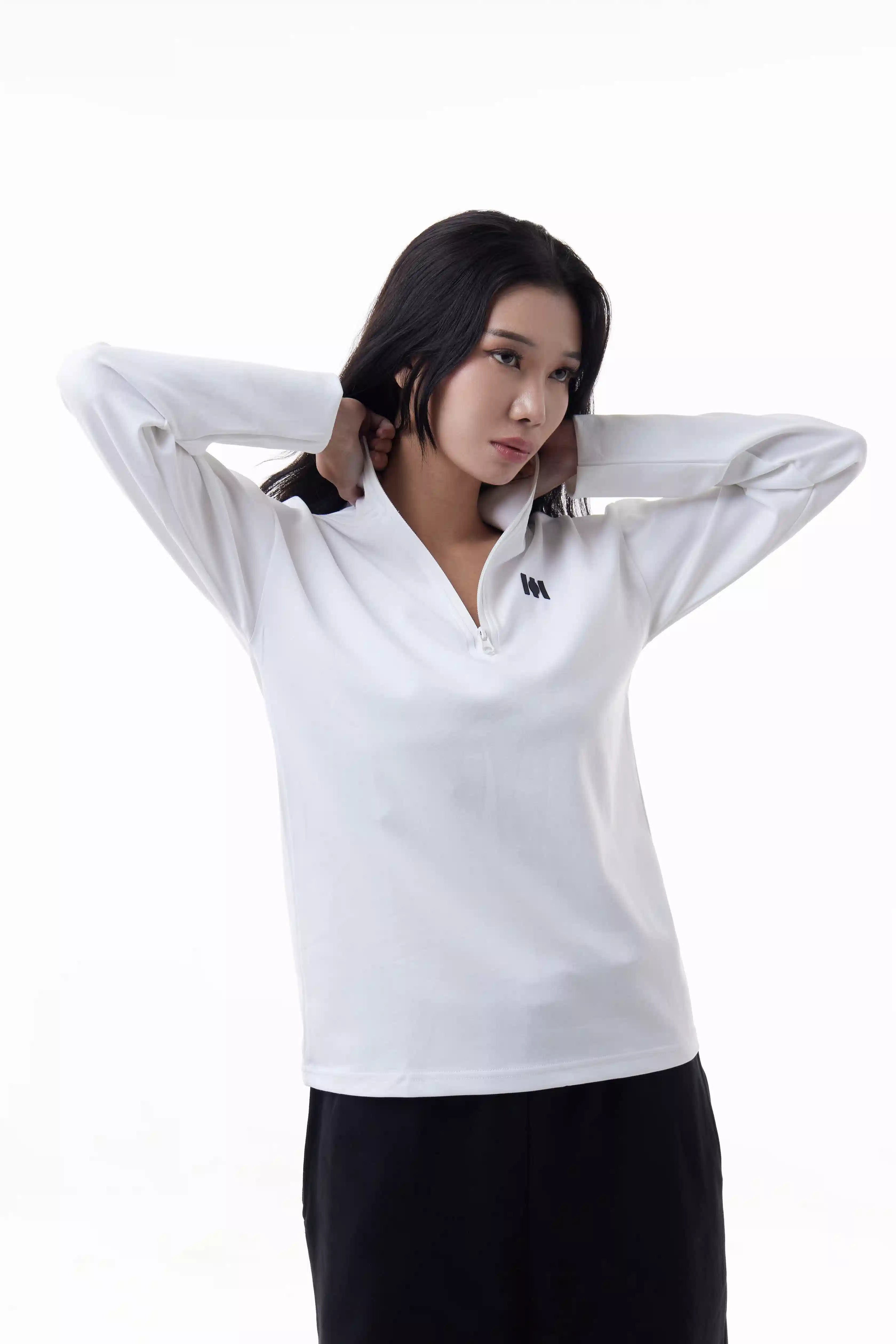 Woman wearing a white Core Zip Up