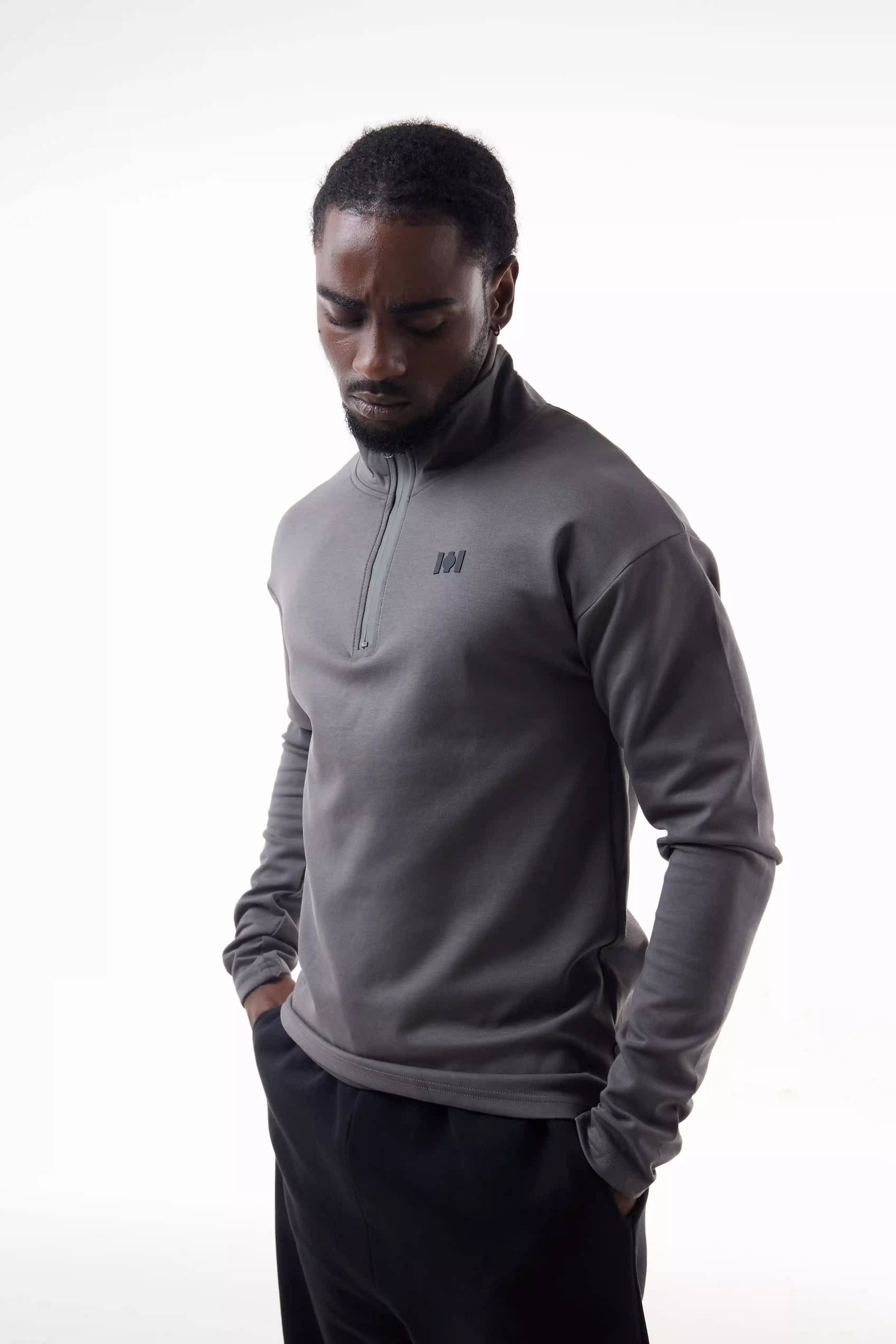 Man wearing a gray Core Zip Up