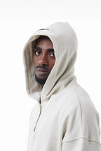 Man wearing a white Elevated Hoodie