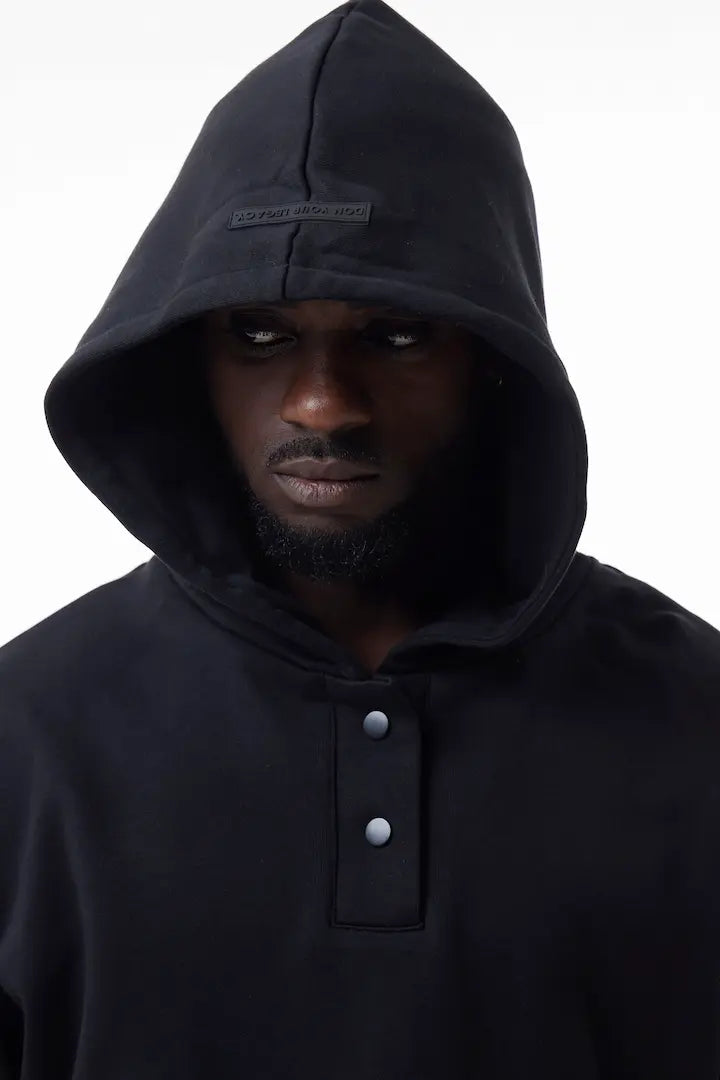 Man wearing a black Elevated Hoodie