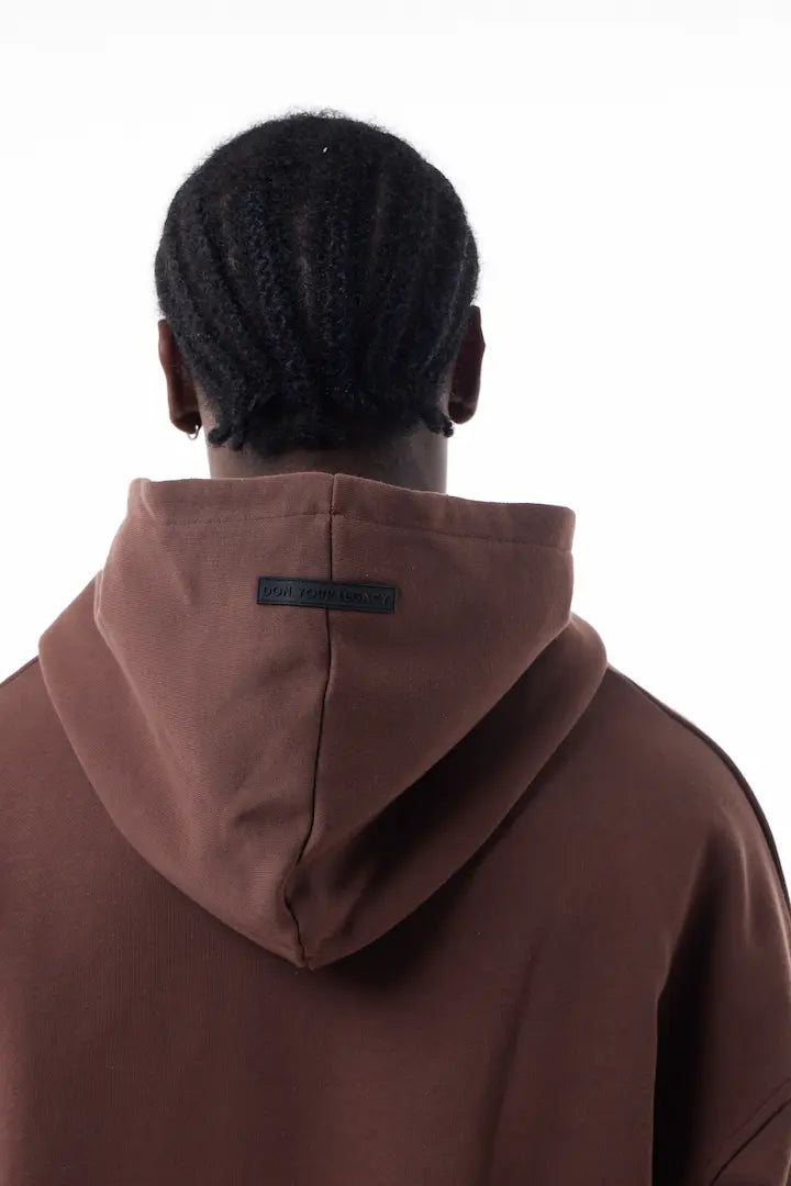 Man wearing a brown Elevated Hoodie