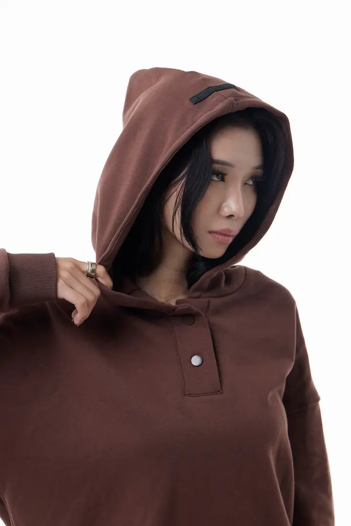 Woman wearing a brown Elevated Hoodie