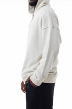 Man wearing a white Elevated Hoodie