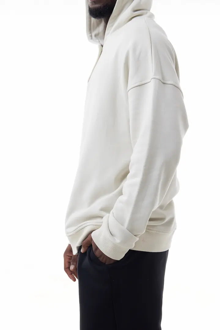 Man wearing a white Elevated Hoodie