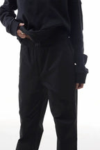 Person wearing black elevation pants