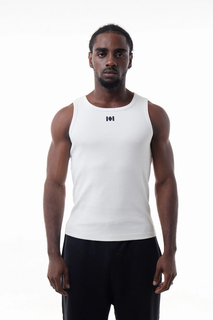 Man wearing a white Power Muscle Tee Tank