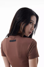 Woman wearing a brown Rev Ride Suit