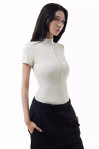 Woman wearing a white Rev Ride Suit