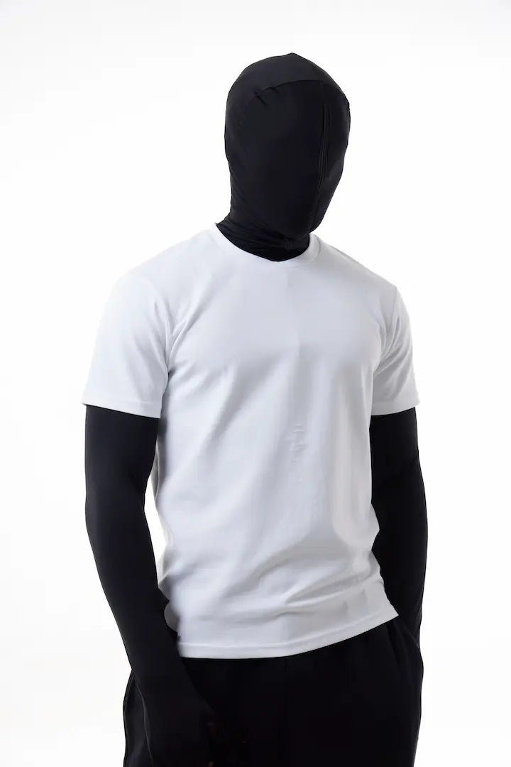 Person wearing a white The Base Tee