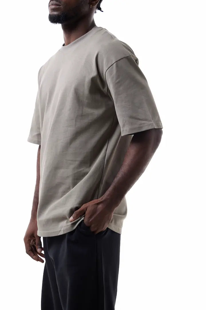 Man wearing a beige Vibe Drift Tee