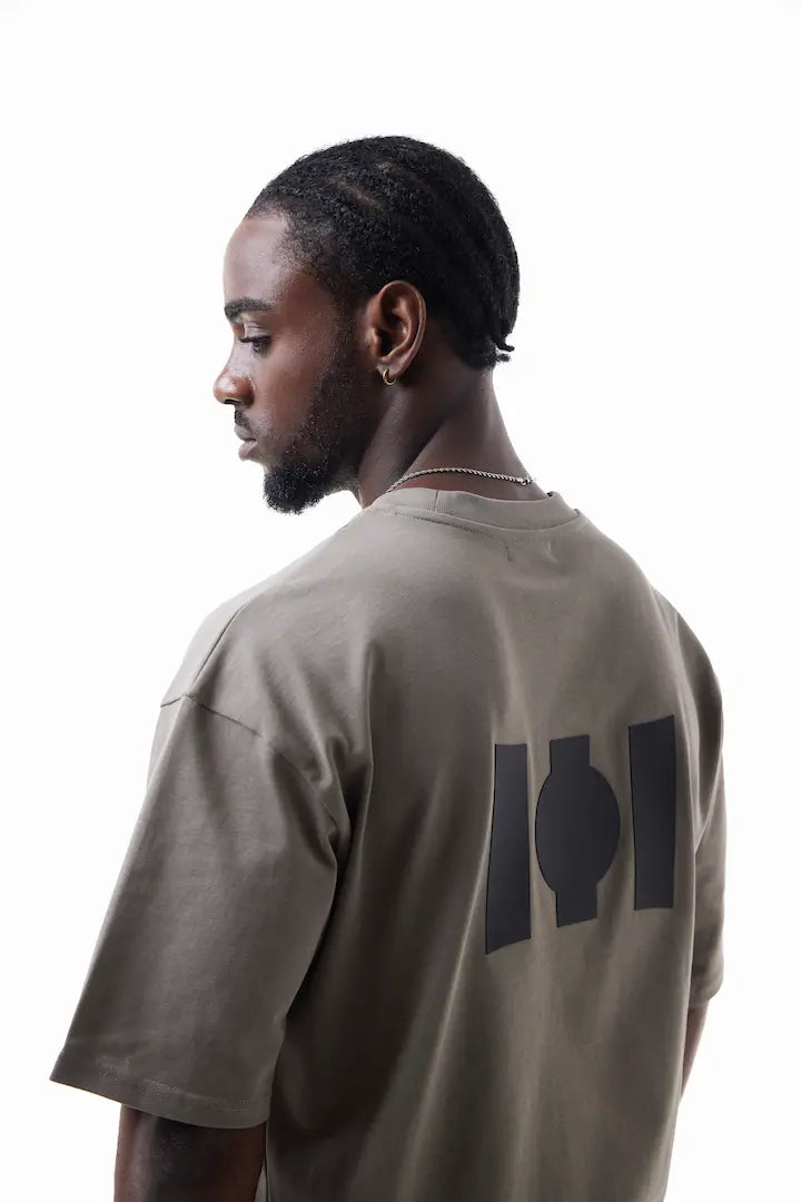 Man wearing a beige Vibe Drift Tee