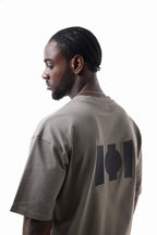Man wearing a beige Vibe Drift Tee