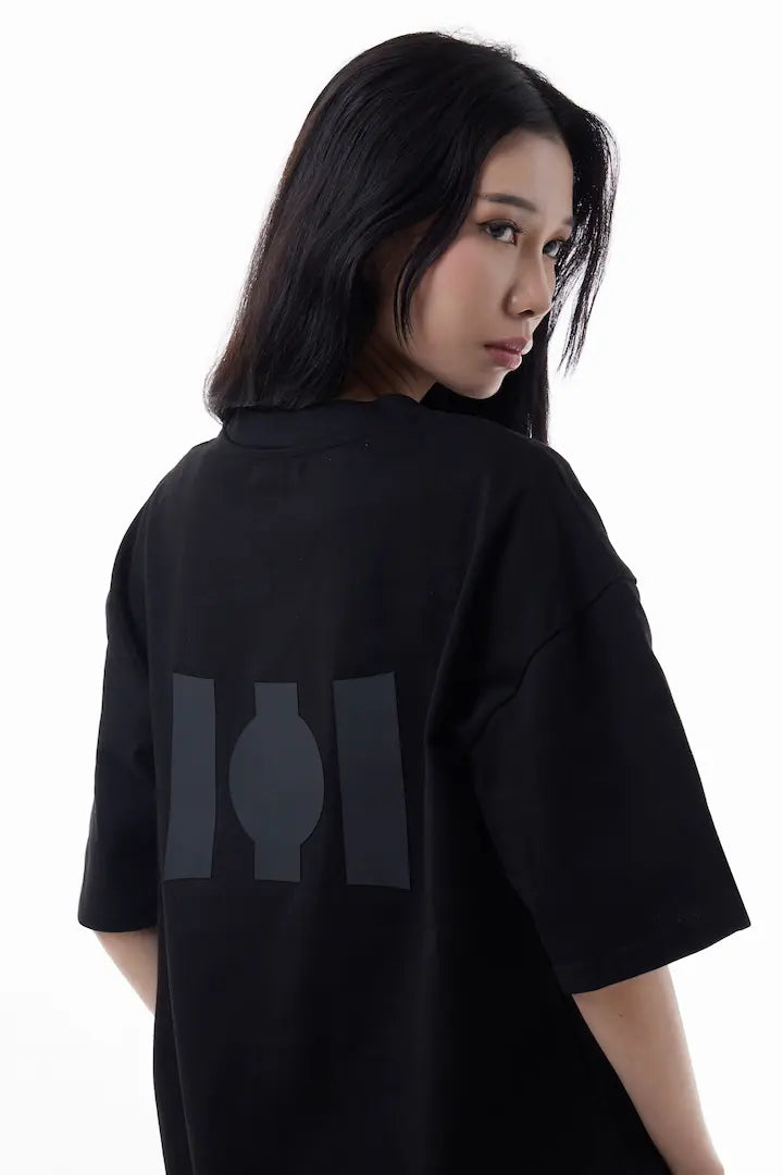 Woman wearing a black Vibe Drift Tee