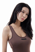 Woman wearing a brown VibeOne Jumpsuit