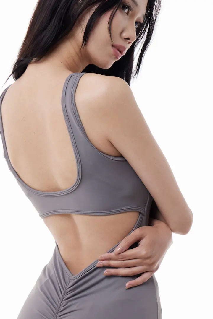 Woman wearing a gray VibeOne Jumpsuit