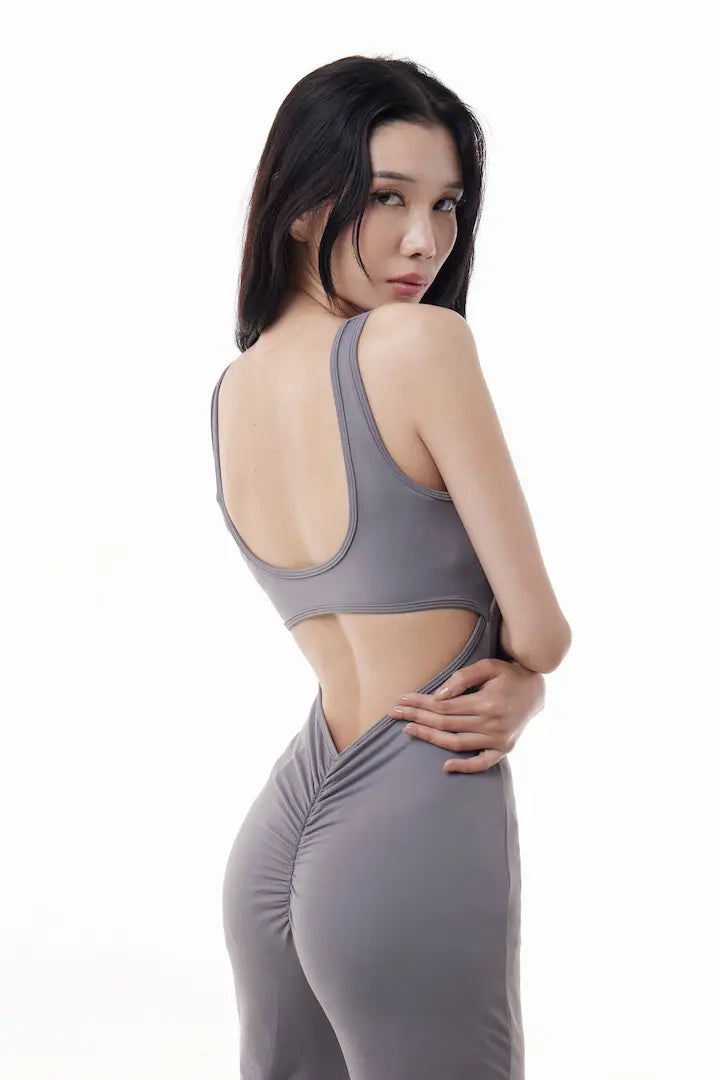 Woman wearing a gray VibeOne Jumpsuit